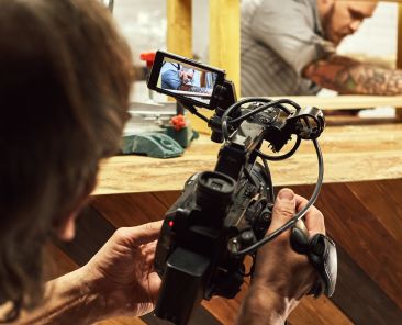 Video production backstage. Behind the scenes of creating video content, a professional team of