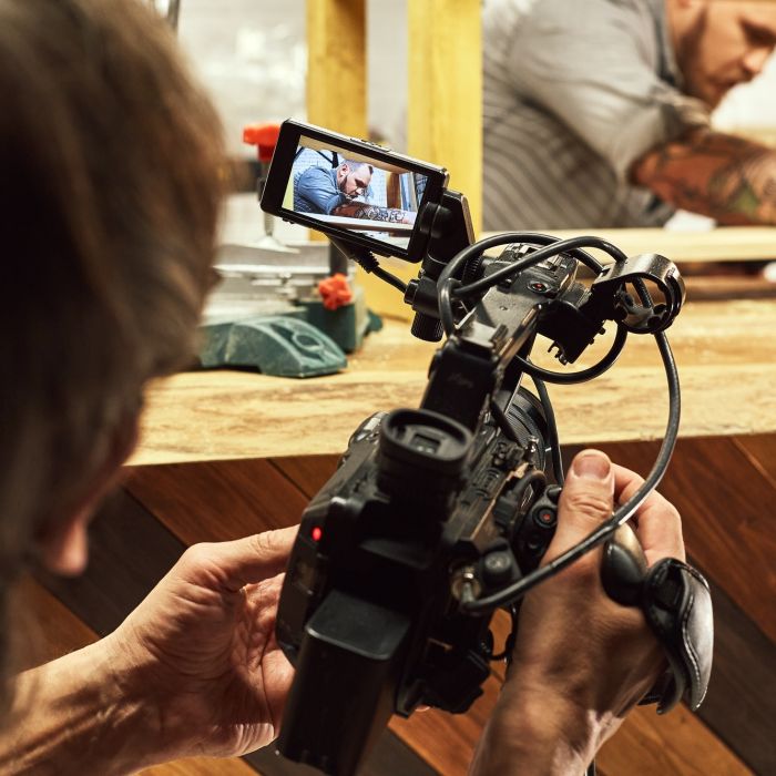 Video production backstage. Behind the scenes of creating video content, a professional team of